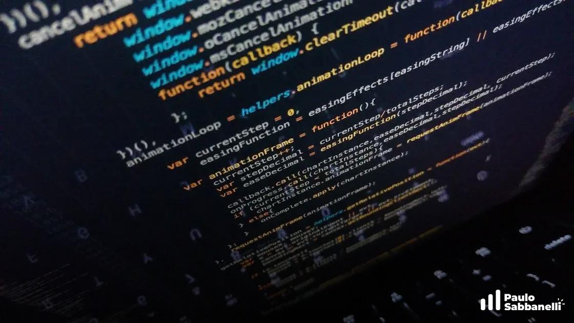Trecho de JavaScript de loop de animação, com teclado do notebook visível por trás da tela